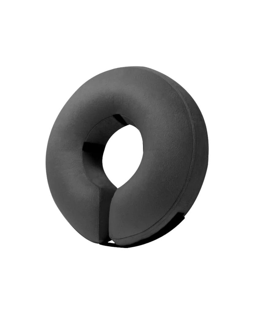 a black round object with a hole in the middle