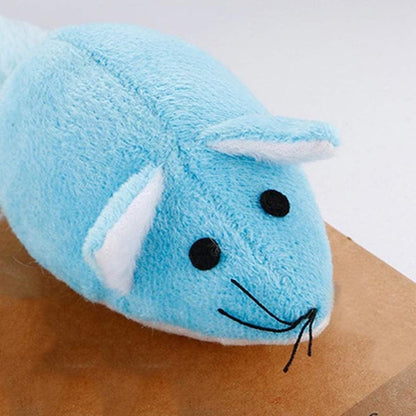 a blue stuffed animal on a brown surface